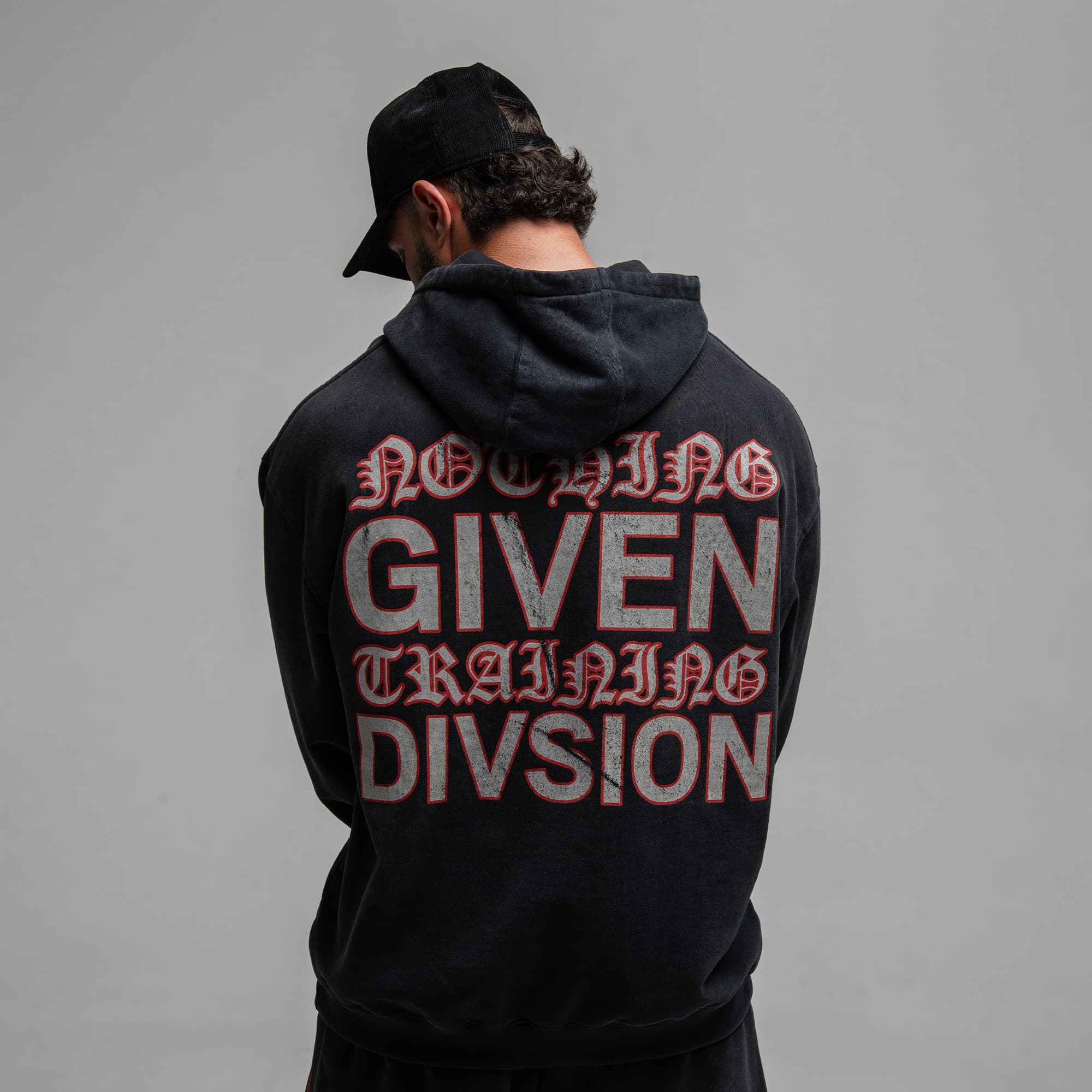 Athlete wearing the Loyalty Club Hoodie half body shot back view