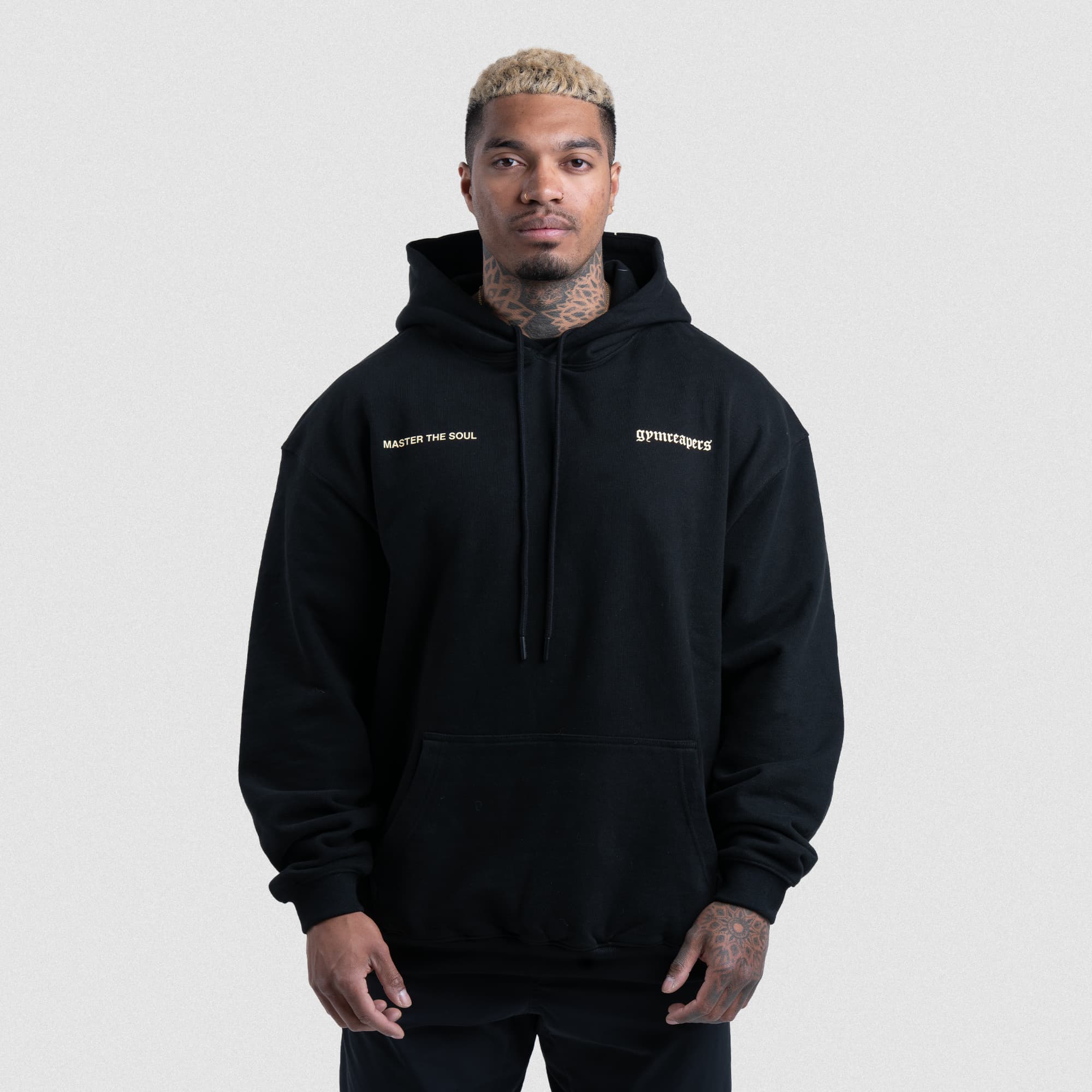 Front of black Master The Soul Hoodie with small chest text and Gymreapers logo.