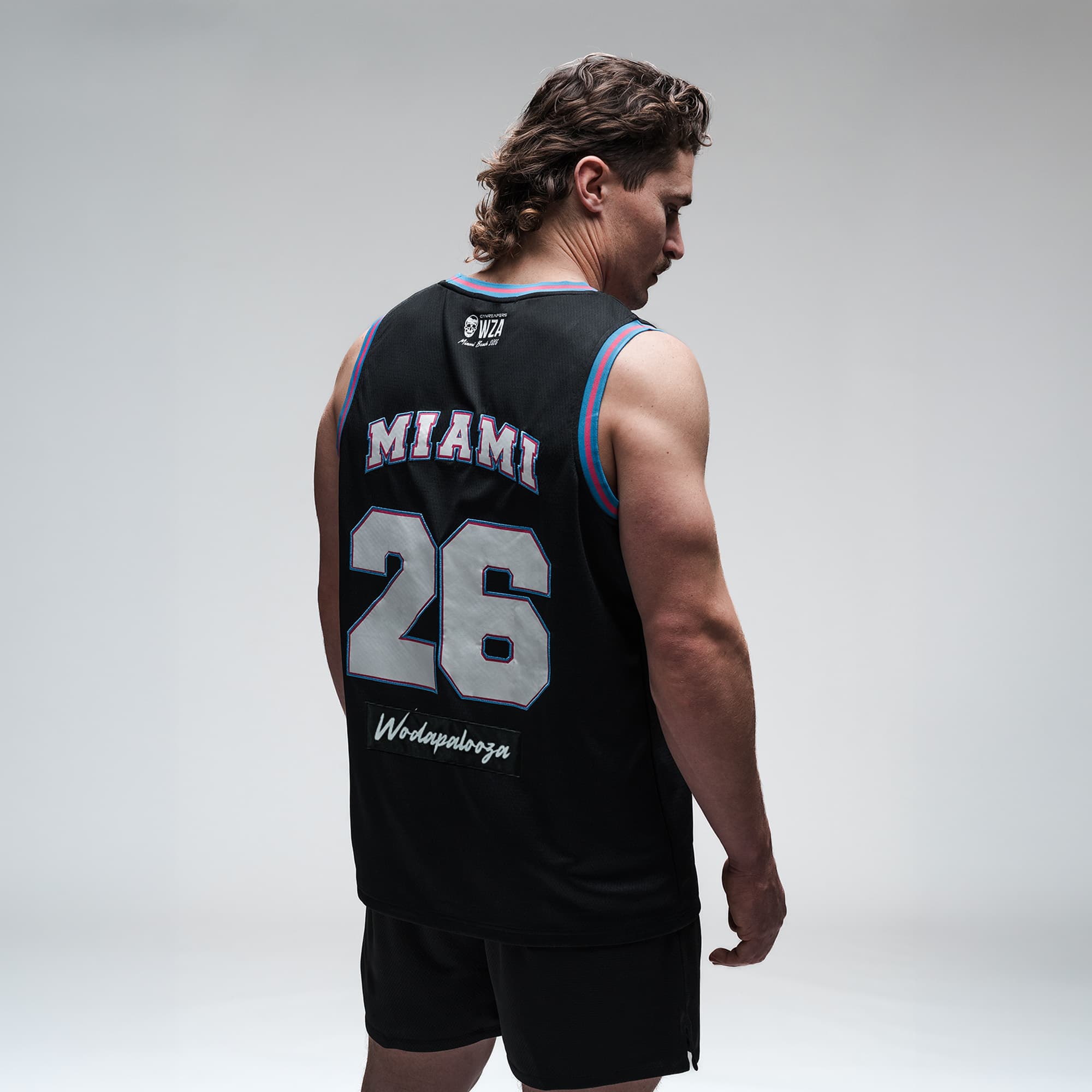 Athlete wearing the Miami Beach Jersey half body shot back view