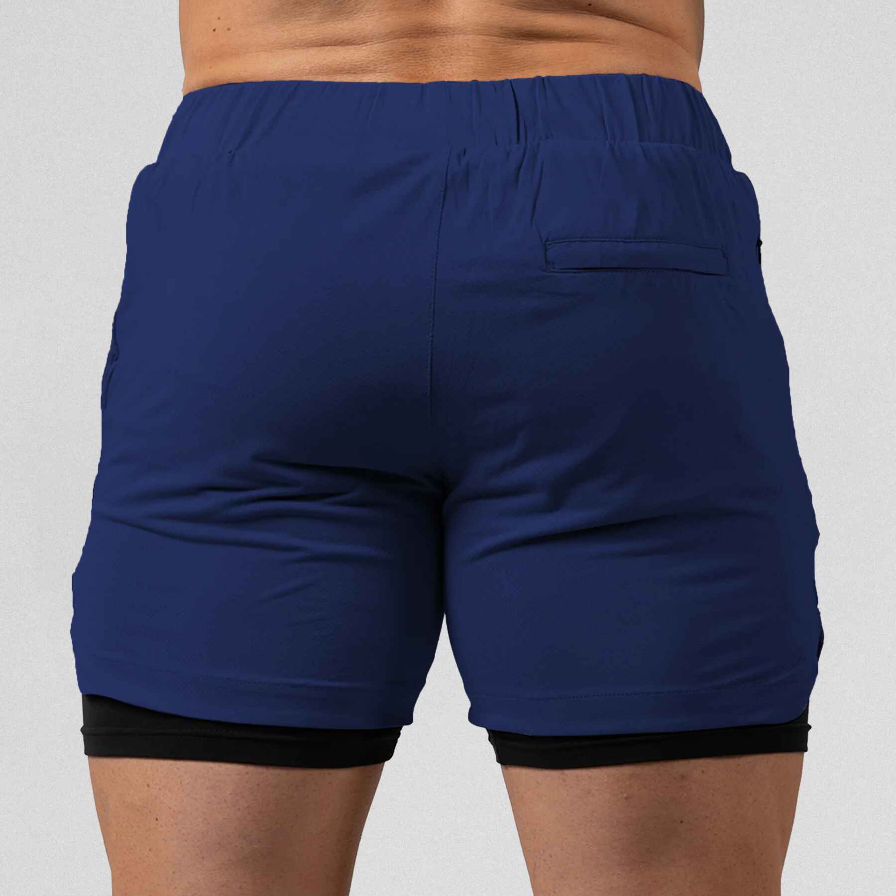 Gymreapers React training shorts navy color way on athlete showcasing the back of the shorts.