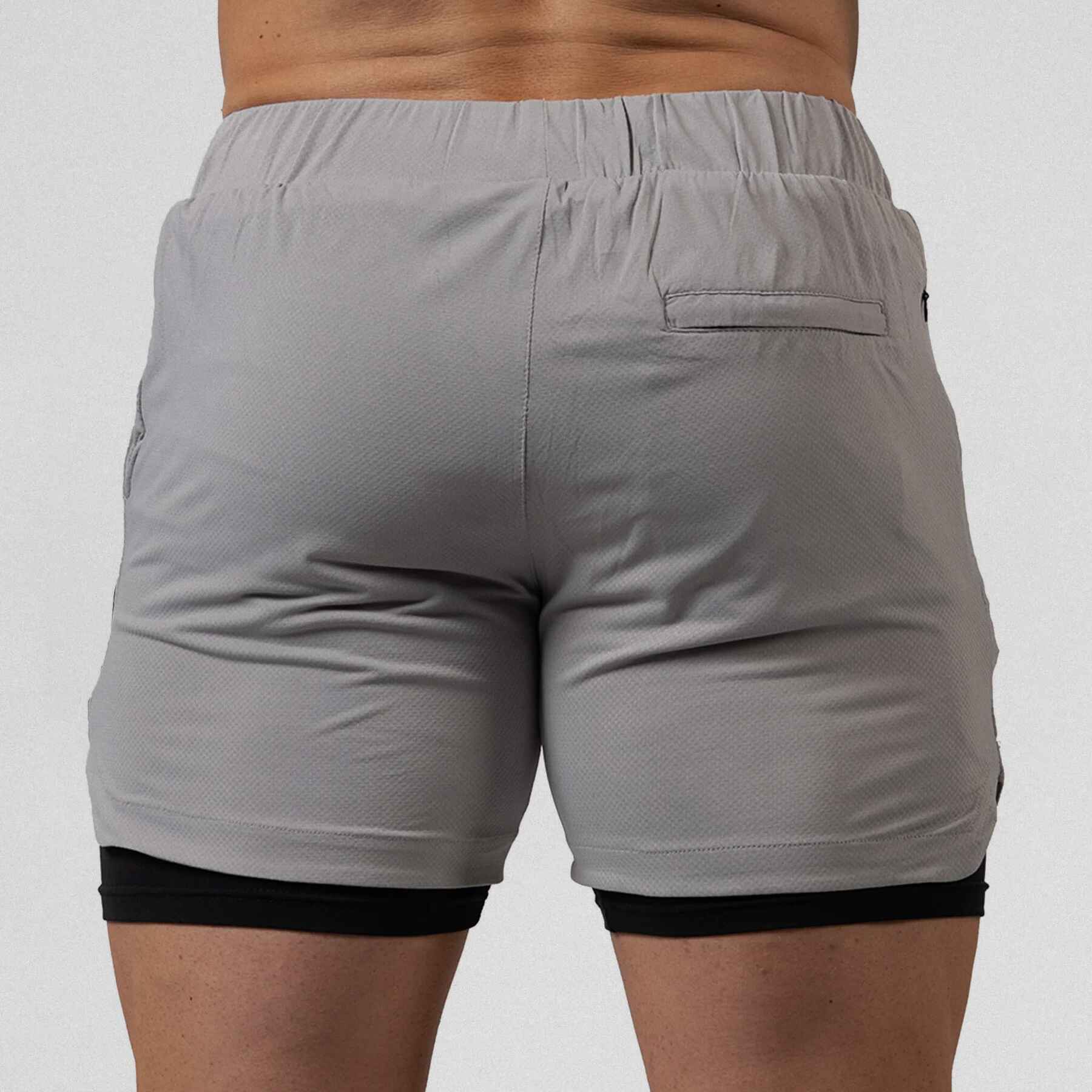 Gymreapers React training shorts slate color way on athlete showcasing the back of the shorts.
