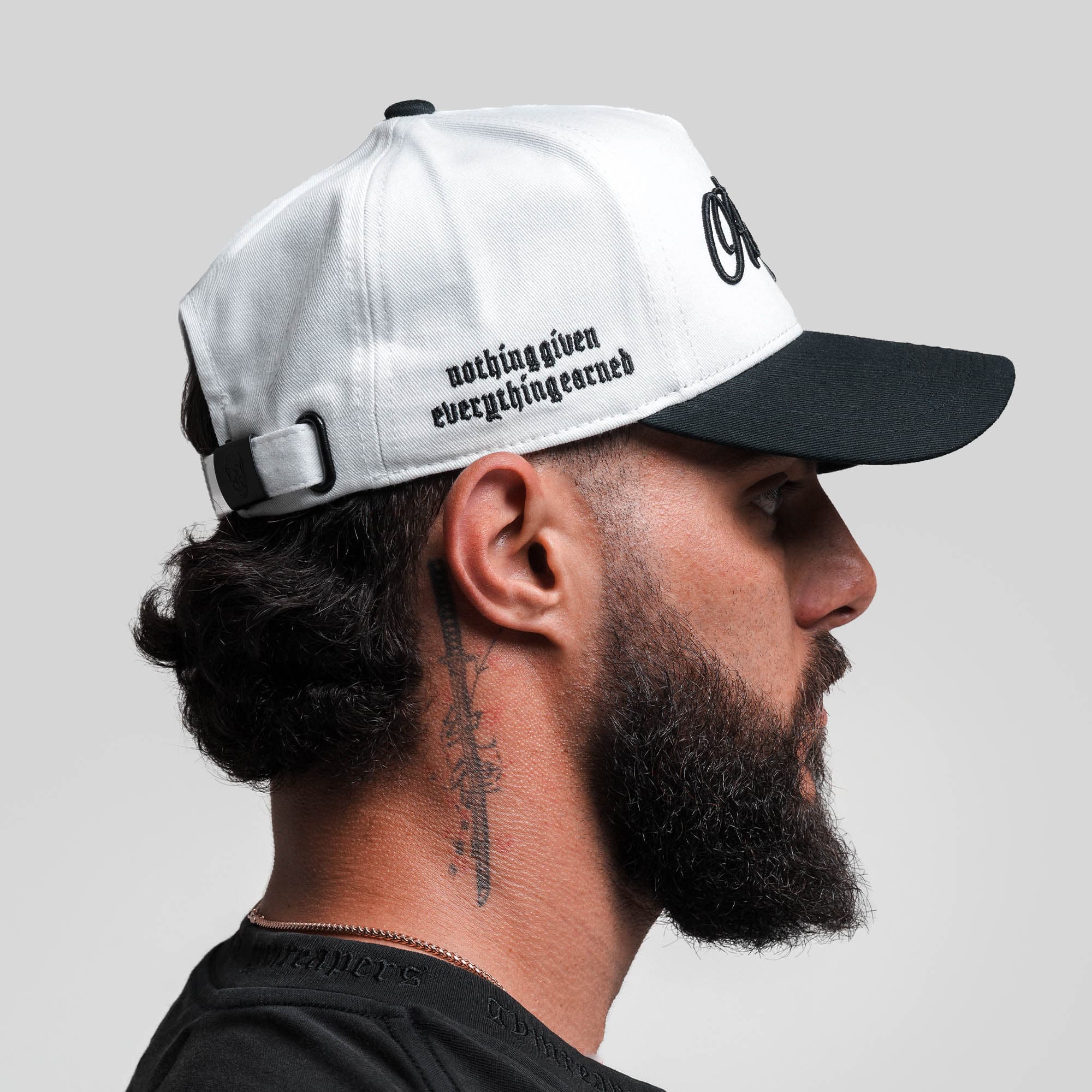 Athlete wearing Reapers 5-Panel Cotton Hat - White/Black side view