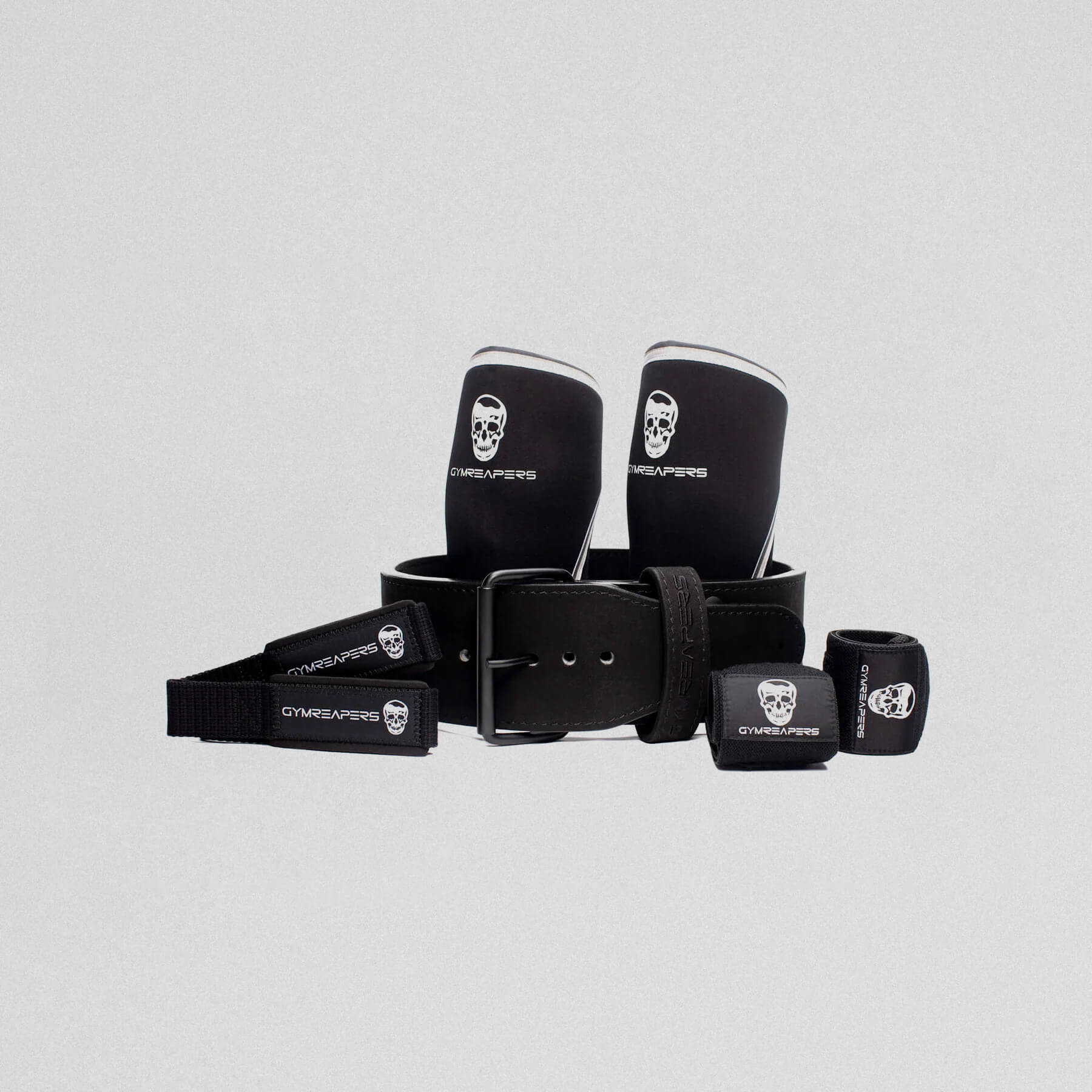 premium 10mm single prong strength kit, showcasing lifting straps, knee sleeves, wrist wraps and the 10mm single prong belt.