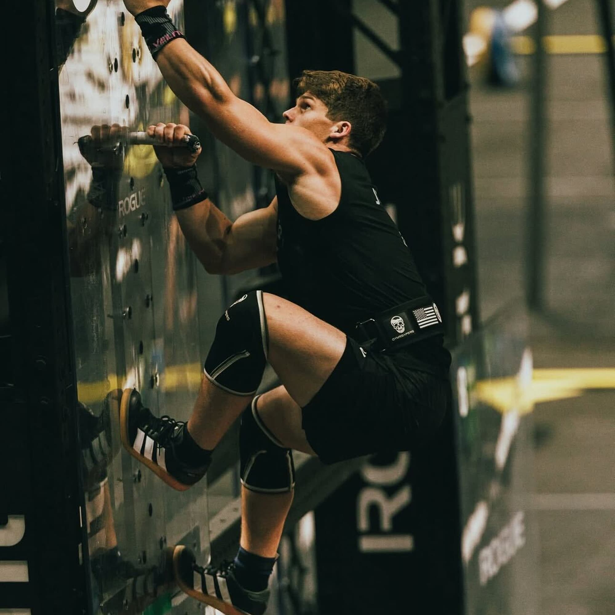 Ty using quick lock belt while climbing