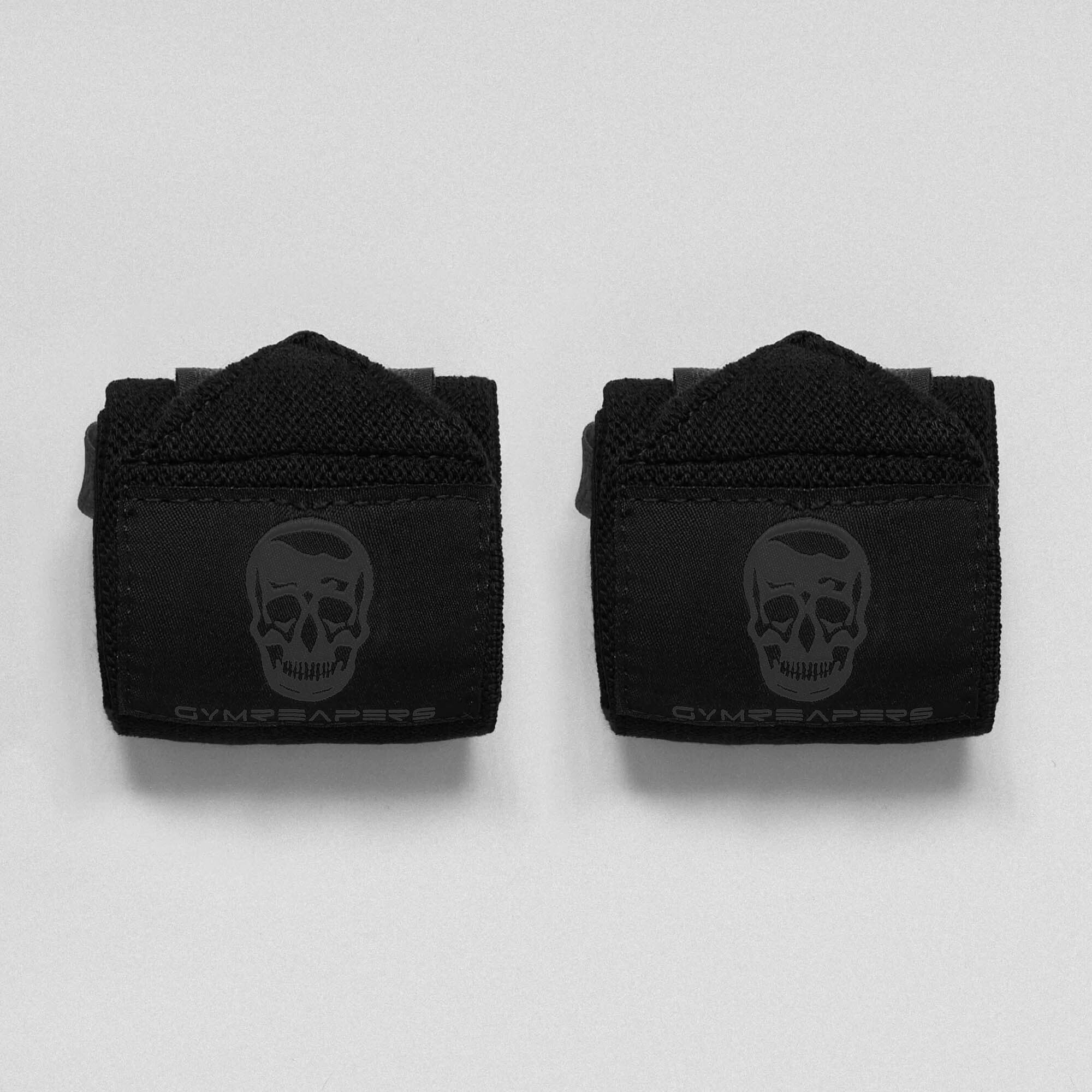 Main image for black/black wrist wraps on studio gray background.